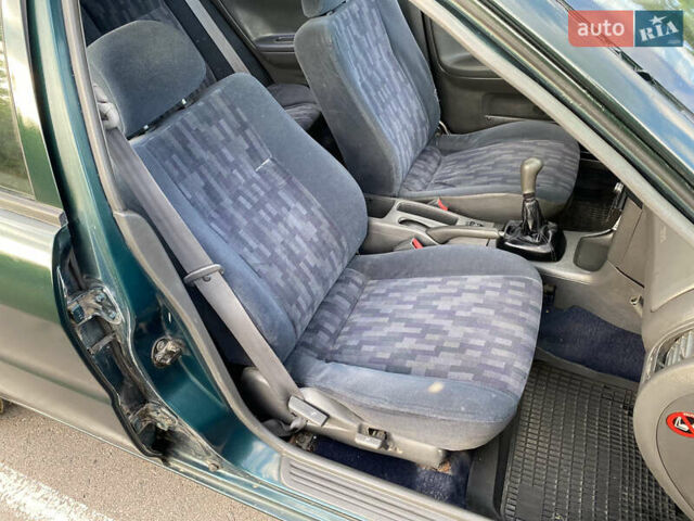 Зелений Міцубісі Lancer, об'ємом двигуна 1.3 л та пробігом 378 тис. км за 1750 $, фото 14 на Automoto.ua