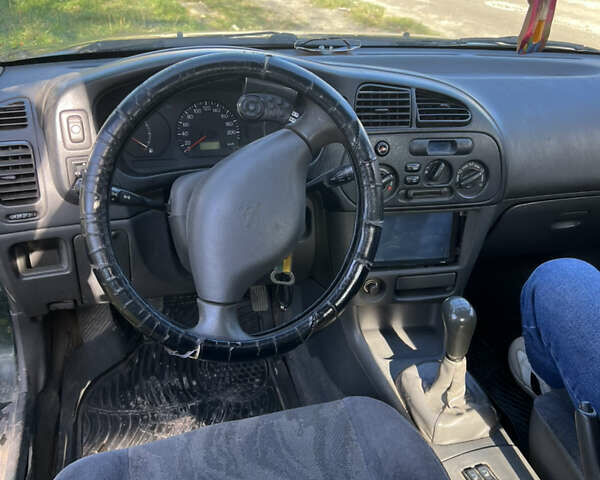 Мицубиси Лансер 2004 в Бережанах на Automoto.ua Зеленый Мицубиси Лансер, объемом двигателя 1.31 л и пробегом 250 тыс. км за 1500 $, фото 6 на Automoto.ua