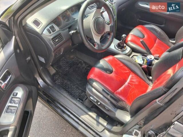 Зеленый Мицубиси Лансер, объемом двигателя 2 л и пробегом 340 тыс. км за 3500 $, фото 11 на Automoto.ua