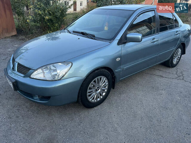 Зелений Міцубісі Lancer, об'ємом двигуна 1.6 л та пробігом 252 тис. км за 3650 $, фото 1 на Automoto.ua