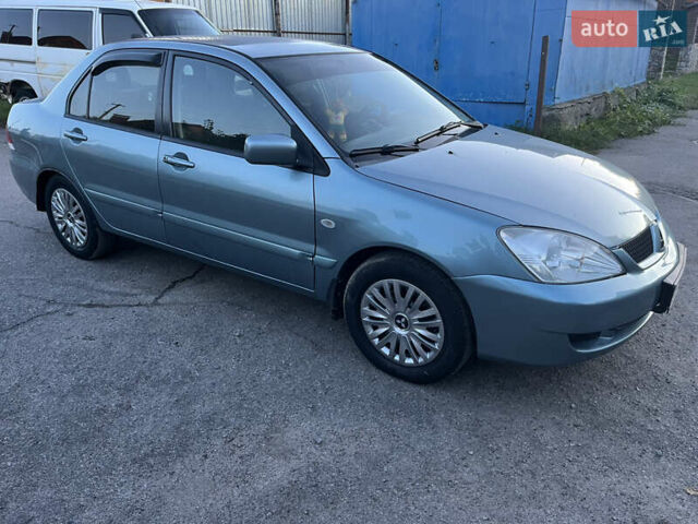 Зелений Міцубісі Lancer, об'ємом двигуна 1.6 л та пробігом 252 тис. км за 3650 $, фото 6 на Automoto.ua