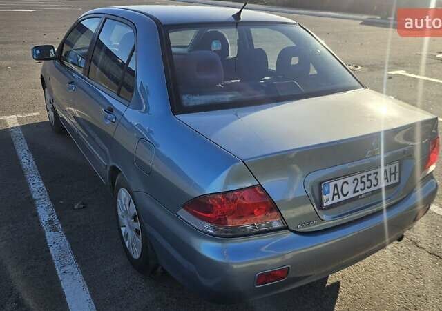 Зелений Міцубісі Lancer, об'ємом двигуна 1.58 л та пробігом 215 тис. км за 5000 $, фото 6 на Automoto.ua