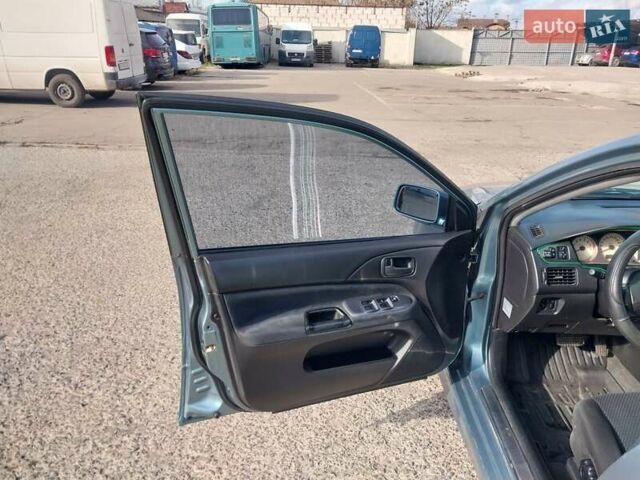 Зелений Міцубісі Lancer, об'ємом двигуна 1.58 л та пробігом 272 тис. км за 3800 $, фото 14 на Automoto.ua