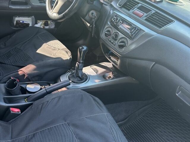 Зелений Міцубісі Lancer, об'ємом двигуна 1.6 л та пробігом 250 тис. км за 4788 $, фото 2 на Automoto.ua