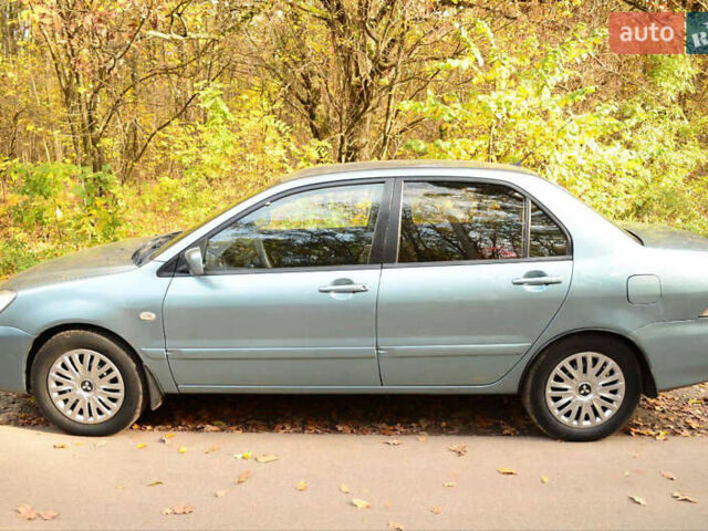 Зеленый Мицубиси Лансер, объемом двигателя 1.58 л и пробегом 259 тыс. км за 4300 $, фото 4 на Automoto.ua