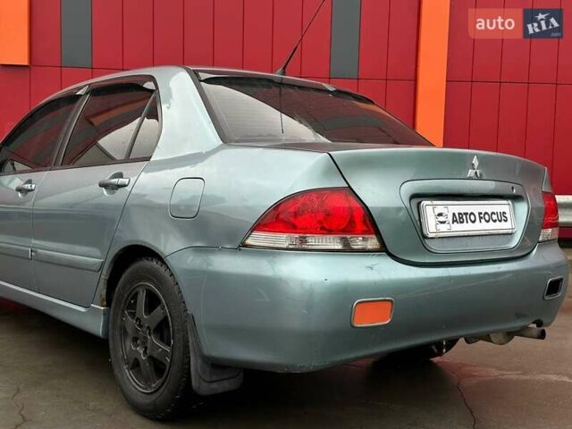Зелений Міцубісі Lancer, об'ємом двигуна 1.58 л та пробігом 208 тис. км за 3990 $, фото 5 на Automoto.ua