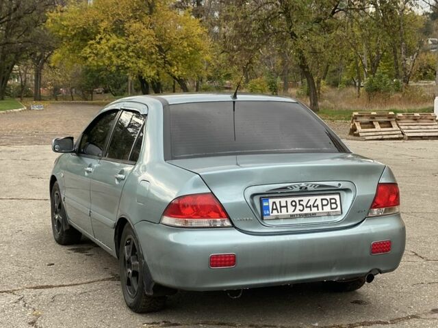 Зелений Міцубісі Lancer, об'ємом двигуна 1.6 л та пробігом 100 тис. км за 3700 $, фото 4 на Automoto.ua