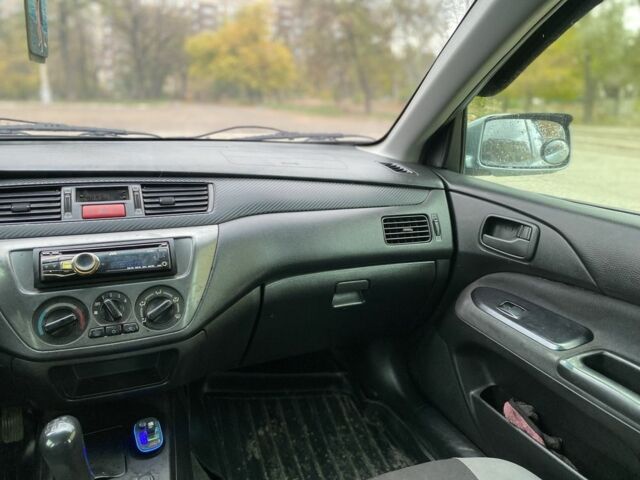 Зелений Міцубісі Lancer, об'ємом двигуна 1.6 л та пробігом 100 тис. км за 3700 $, фото 7 на Automoto.ua