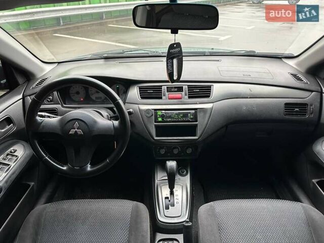 Зелений Міцубісі Lancer, об'ємом двигуна 1.58 л та пробігом 208 тис. км за 3990 $, фото 12 на Automoto.ua