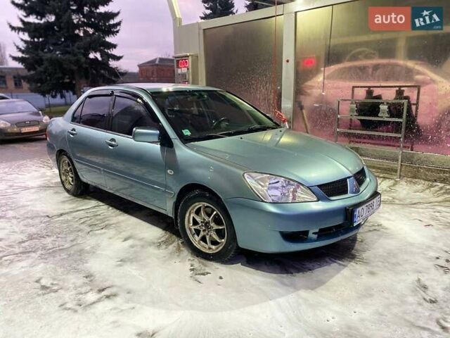 Зеленый Мицубиси Лансер, объемом двигателя 1.58 л и пробегом 352 тыс. км за 3700 $, фото 4 на Automoto.ua