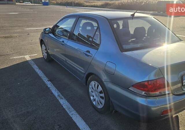 Зелений Міцубісі Lancer, об'ємом двигуна 1.58 л та пробігом 215 тис. км за 5000 $, фото 4 на Automoto.ua