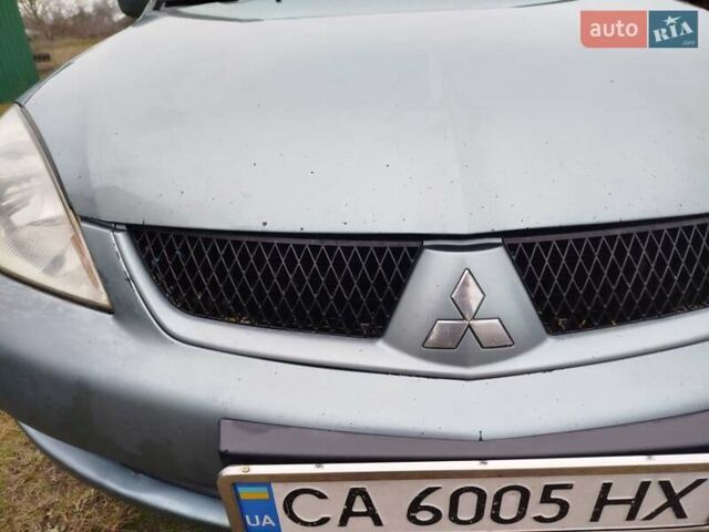 Зеленый Мицубиси Лансер, объемом двигателя 1.58 л и пробегом 224 тыс. км за 3500 $, фото 9 на Automoto.ua