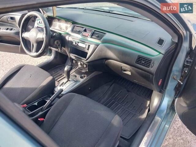 Зелений Міцубісі Lancer, об'ємом двигуна 1.58 л та пробігом 272 тис. км за 3800 $, фото 19 на Automoto.ua