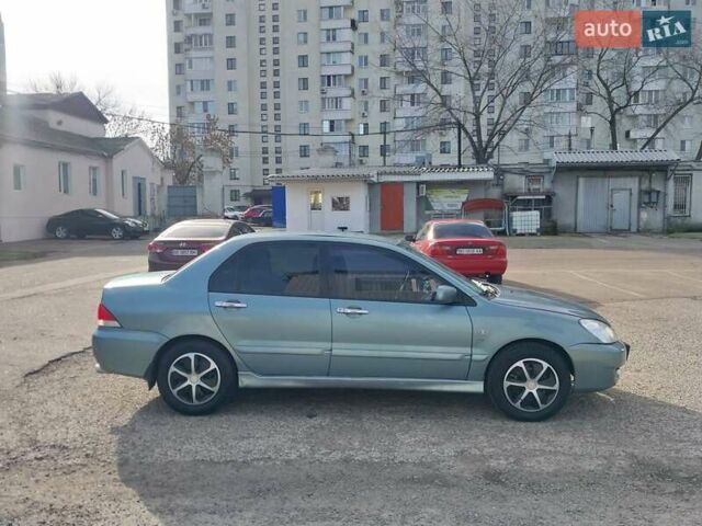 Зелений Міцубісі Lancer, об'ємом двигуна 1.58 л та пробігом 272 тис. км за 3800 $, фото 11 на Automoto.ua