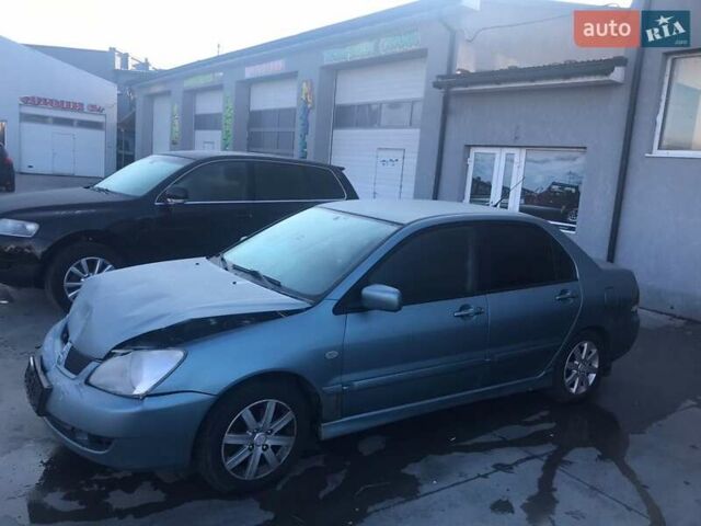 Зеленый Мицубиси Лансер, объемом двигателя 1.6 л и пробегом 184 тыс. км за 2000 $, фото 2 на Automoto.ua