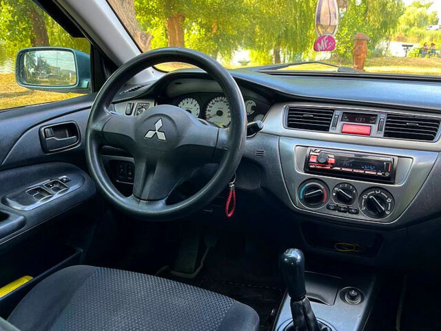 Зелений Міцубісі Lancer, об'ємом двигуна 1.6 л та пробігом 290 тис. км за 4450 $, фото 12 на Automoto.ua