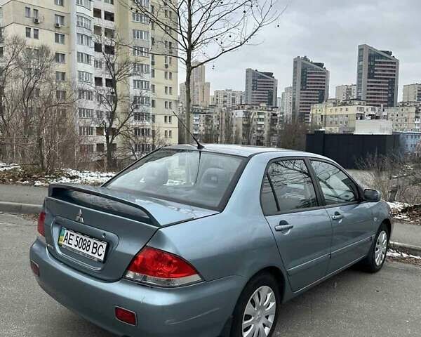 Зеленый Мицубиси Лансер, объемом двигателя 1.58 л и пробегом 207 тыс. км за 4200 $, фото 7 на Automoto.ua