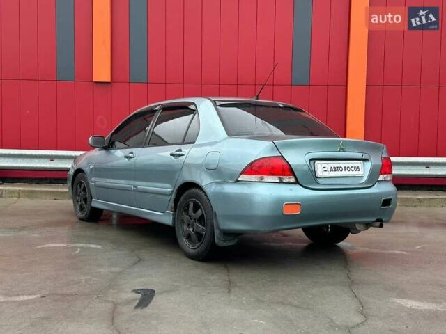 Зелений Міцубісі Lancer, об'ємом двигуна 1.58 л та пробігом 208 тис. км за 3990 $, фото 4 на Automoto.ua