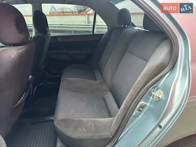 Зелений Міцубісі Lancer, об'ємом двигуна 1.58 л та пробігом 208 тис. км за 3990 $, фото 9 на Automoto.ua