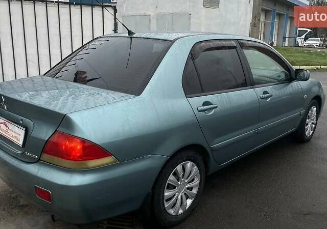 Зелений Міцубісі Lancer, об'ємом двигуна 1.6 л та пробігом 262 тис. км за 3999 $, фото 6 на Automoto.ua