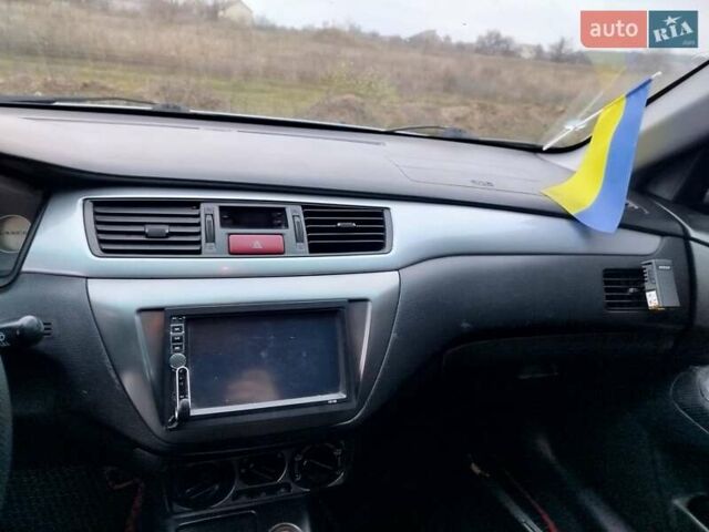 Зеленый Мицубиси Лансер, объемом двигателя 1.58 л и пробегом 224 тыс. км за 3500 $, фото 18 на Automoto.ua