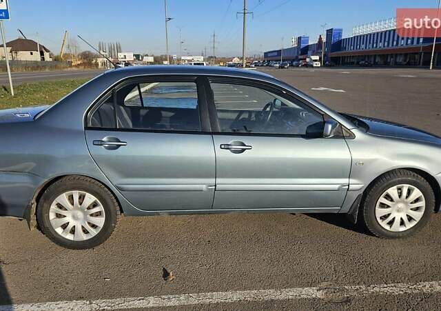 Зелений Міцубісі Lancer, об'ємом двигуна 1.58 л та пробігом 215 тис. км за 5000 $, фото 7 на Automoto.ua