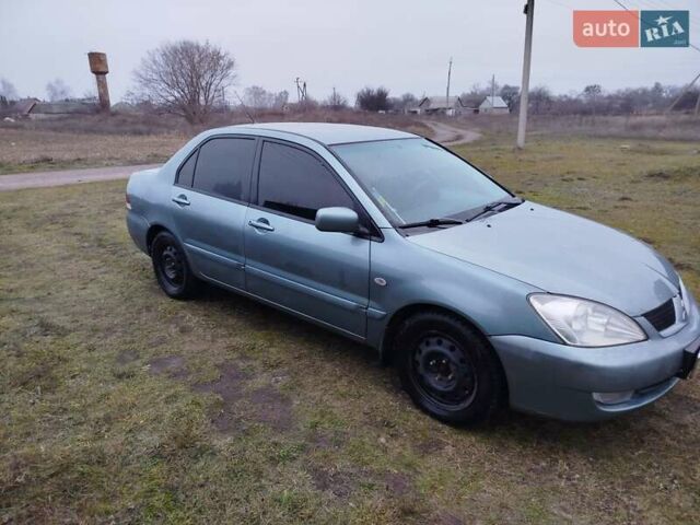 Зеленый Мицубиси Лансер, объемом двигателя 1.58 л и пробегом 224 тыс. км за 3500 $, фото 6 на Automoto.ua