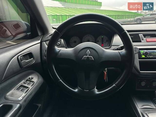 Зелений Міцубісі Lancer, об'ємом двигуна 1.58 л та пробігом 208 тис. км за 3990 $, фото 14 на Automoto.ua