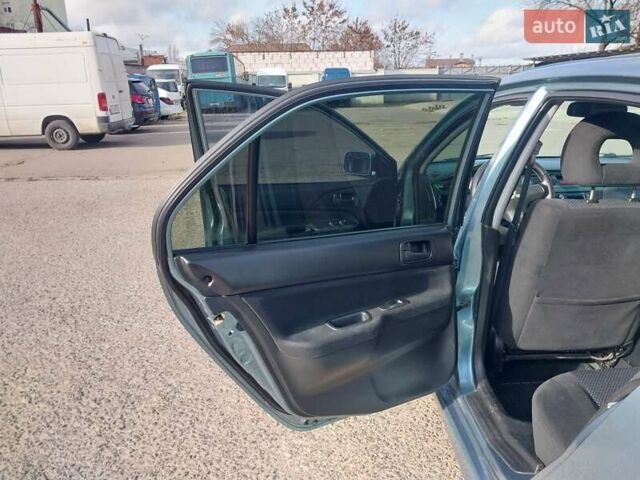 Зелений Міцубісі Lancer, об'ємом двигуна 1.58 л та пробігом 272 тис. км за 3800 $, фото 22 на Automoto.ua