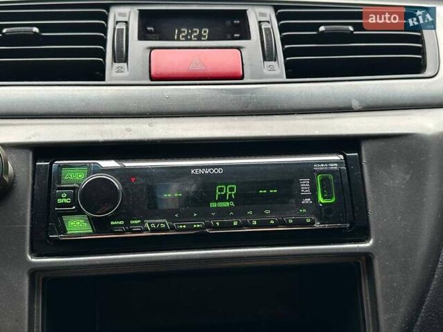 Зелений Міцубісі Lancer, об'ємом двигуна 1.58 л та пробігом 208 тис. км за 3990 $, фото 19 на Automoto.ua