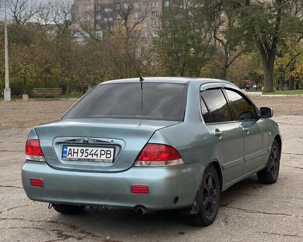 Міцубісі Lancer 2006 у Краматорске на Automoto.ua Зелений Міцубісі Lancer, об'ємом двигуна 1.58 л та пробігом 100 тис. км за 3700 $, фото 3 на Automoto.ua