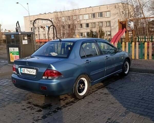 Зеленый Мицубиси Лансер, объемом двигателя 1.58 л и пробегом 244 тыс. км за 4900 $, фото 2 на Automoto.ua