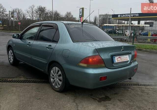 Зелений Міцубісі Lancer, об'ємом двигуна 1.6 л та пробігом 262 тис. км за 3999 $, фото 4 на Automoto.ua
