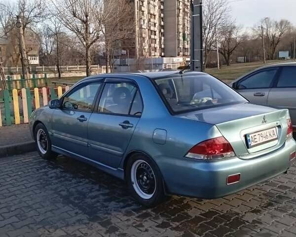 Зеленый Мицубиси Лансер, объемом двигателя 1.58 л и пробегом 244 тыс. км за 4900 $, фото 1 на Automoto.ua