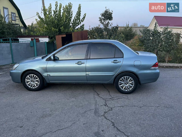 Зелений Міцубісі Lancer, об'ємом двигуна 1.6 л та пробігом 252 тис. км за 3650 $, фото 12 на Automoto.ua
