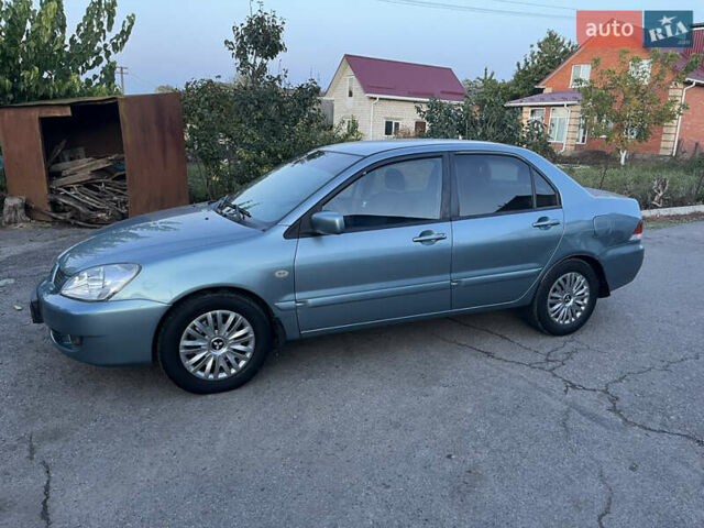 Зелений Міцубісі Lancer, об'ємом двигуна 1.6 л та пробігом 252 тис. км за 3650 $, фото 11 на Automoto.ua