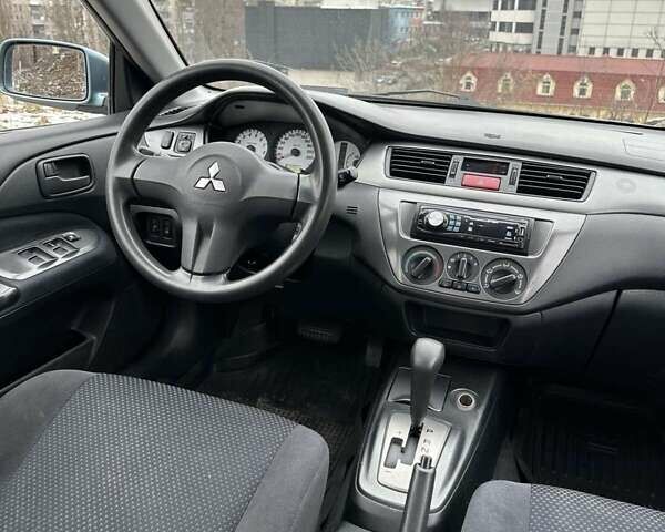 Зеленый Мицубиси Лансер, объемом двигателя 1.58 л и пробегом 209 тыс. км за 4100 $, фото 11 на Automoto.ua