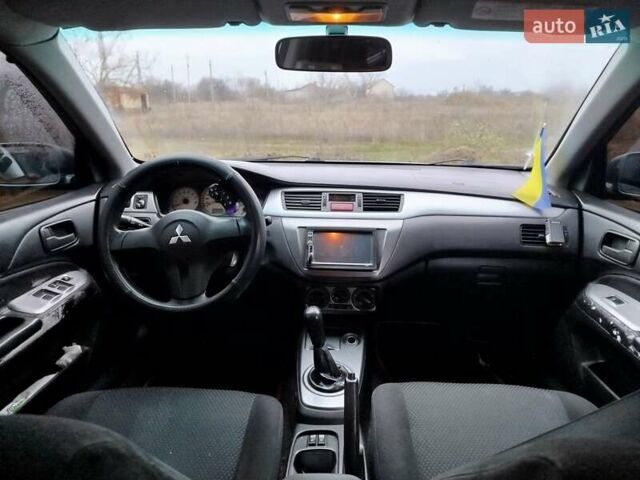 Зеленый Мицубиси Лансер, объемом двигателя 1.58 л и пробегом 224 тыс. км за 3500 $, фото 11 на Automoto.ua
