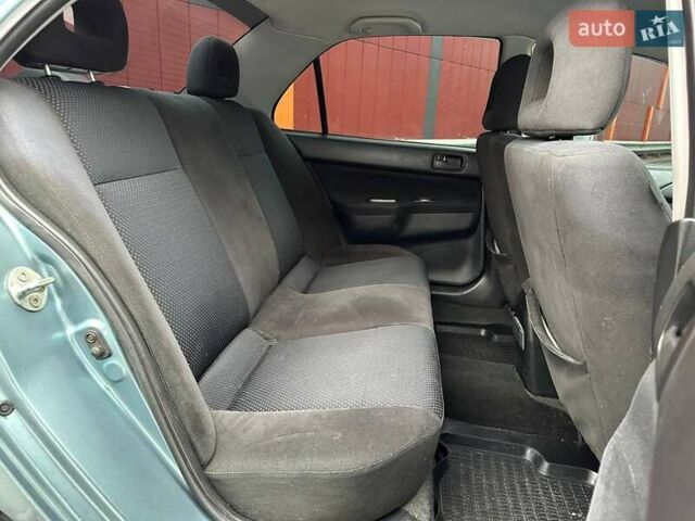 Зелений Міцубісі Lancer, об'ємом двигуна 1.58 л та пробігом 208 тис. км за 3990 $, фото 10 на Automoto.ua