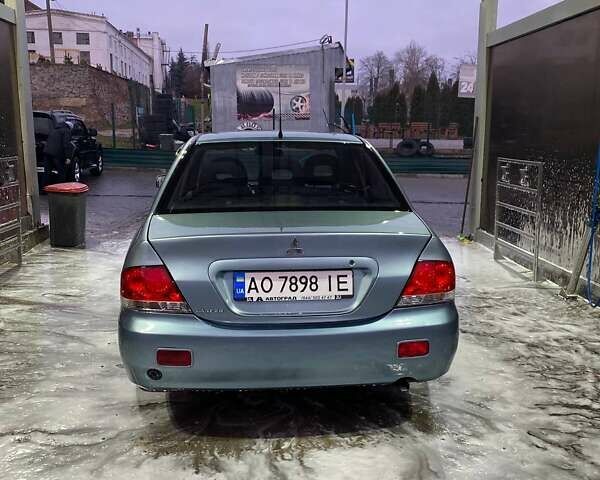 Зеленый Мицубиси Лансер, объемом двигателя 1.58 л и пробегом 352 тыс. км за 3700 $, фото 5 на Automoto.ua