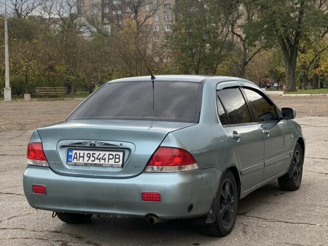 Зелений Міцубісі Lancer, об'ємом двигуна 1.6 л та пробігом 100 тис. км за 3700 $, фото 3 на Automoto.ua