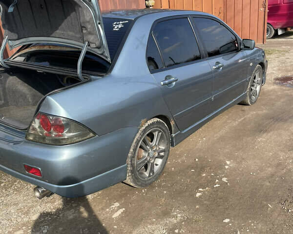 Зелений Міцубісі Lancer, об'ємом двигуна 2 л та пробігом 274 тис. км за 4399 $, фото 13 на Automoto.ua