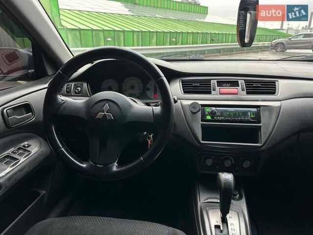 Зелений Міцубісі Lancer, об'ємом двигуна 1.58 л та пробігом 208 тис. км за 3990 $, фото 13 на Automoto.ua