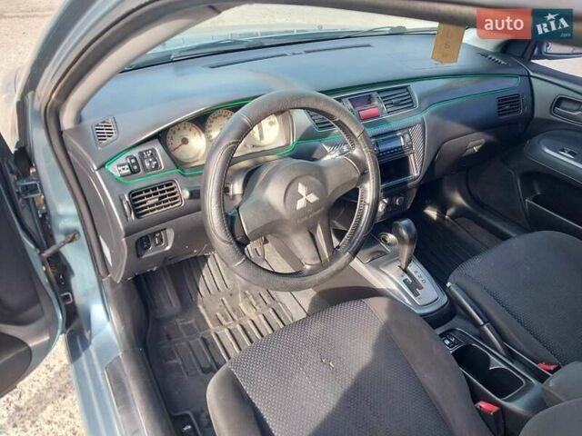Зелений Міцубісі Lancer, об'ємом двигуна 1.58 л та пробігом 272 тис. км за 3800 $, фото 15 на Automoto.ua