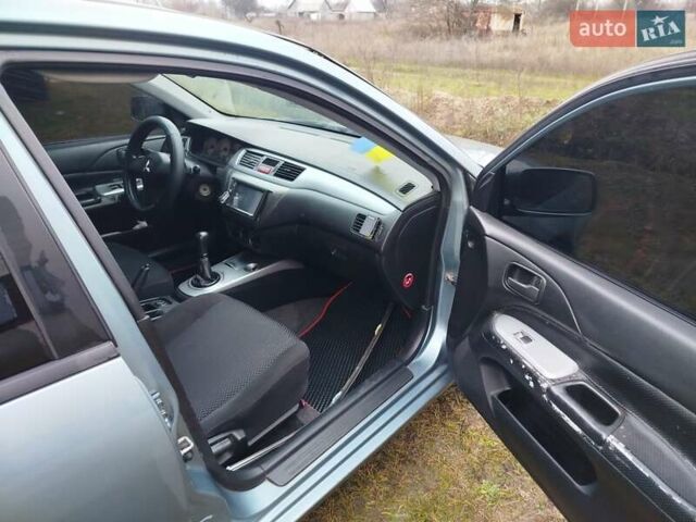 Зеленый Мицубиси Лансер, объемом двигателя 1.58 л и пробегом 224 тыс. км за 3500 $, фото 12 на Automoto.ua