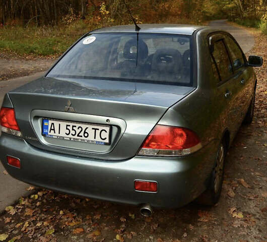 Зеленый Мицубиси Лансер, объемом двигателя 1.58 л и пробегом 259 тыс. км за 4300 $, фото 1 на Automoto.ua