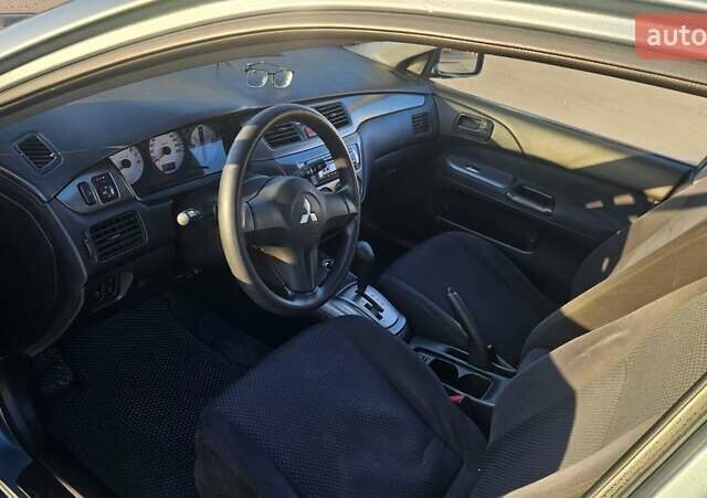 Зелений Міцубісі Lancer, об'ємом двигуна 1.58 л та пробігом 215 тис. км за 5000 $, фото 8 на Automoto.ua