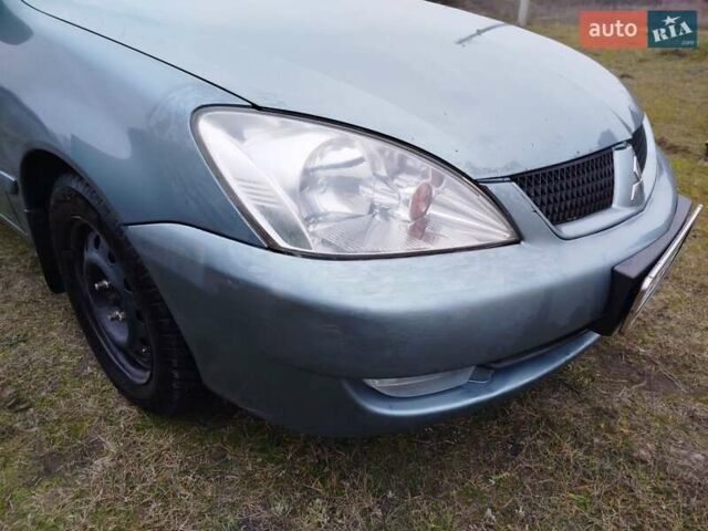 Зеленый Мицубиси Лансер, объемом двигателя 1.58 л и пробегом 224 тыс. км за 3500 $, фото 7 на Automoto.ua