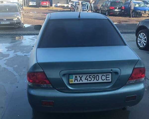 Зеленый Мицубиси Лансер, объемом двигателя 1.6 л и пробегом 184 тыс. км за 2000 $, фото 6 на Automoto.ua