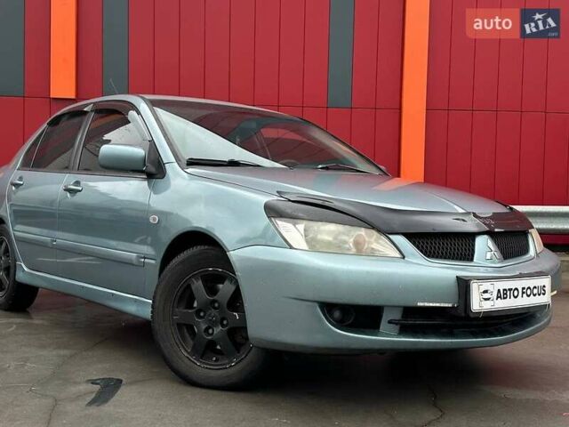 Зелений Міцубісі Lancer, об'ємом двигуна 1.58 л та пробігом 208 тис. км за 3990 $, фото 1 на Automoto.ua